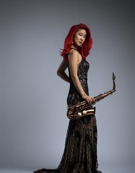 Grace Kelly in full gown with sax